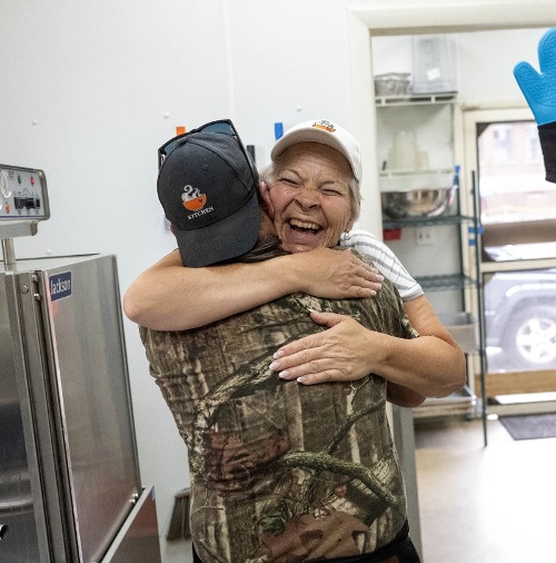 Carla Hugging Volunteer